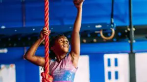girl on the gym rings