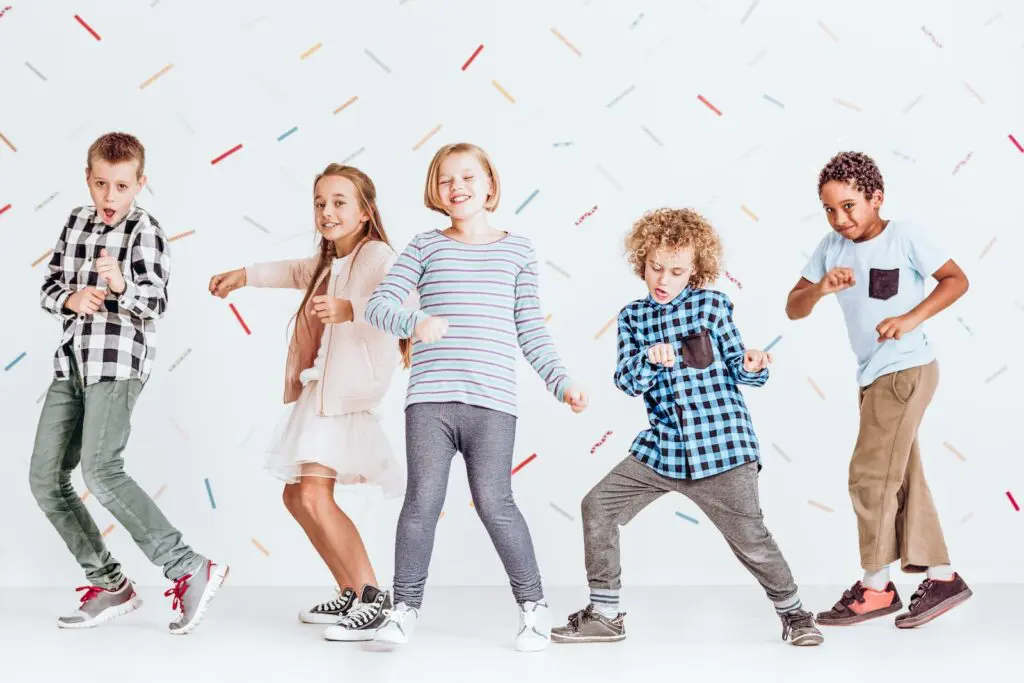 Group of kids having fun and dancing