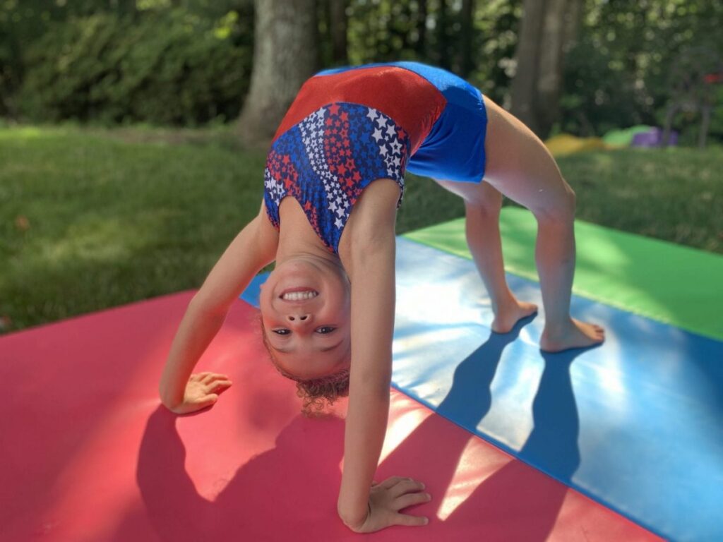 little girl doing gymnastics
