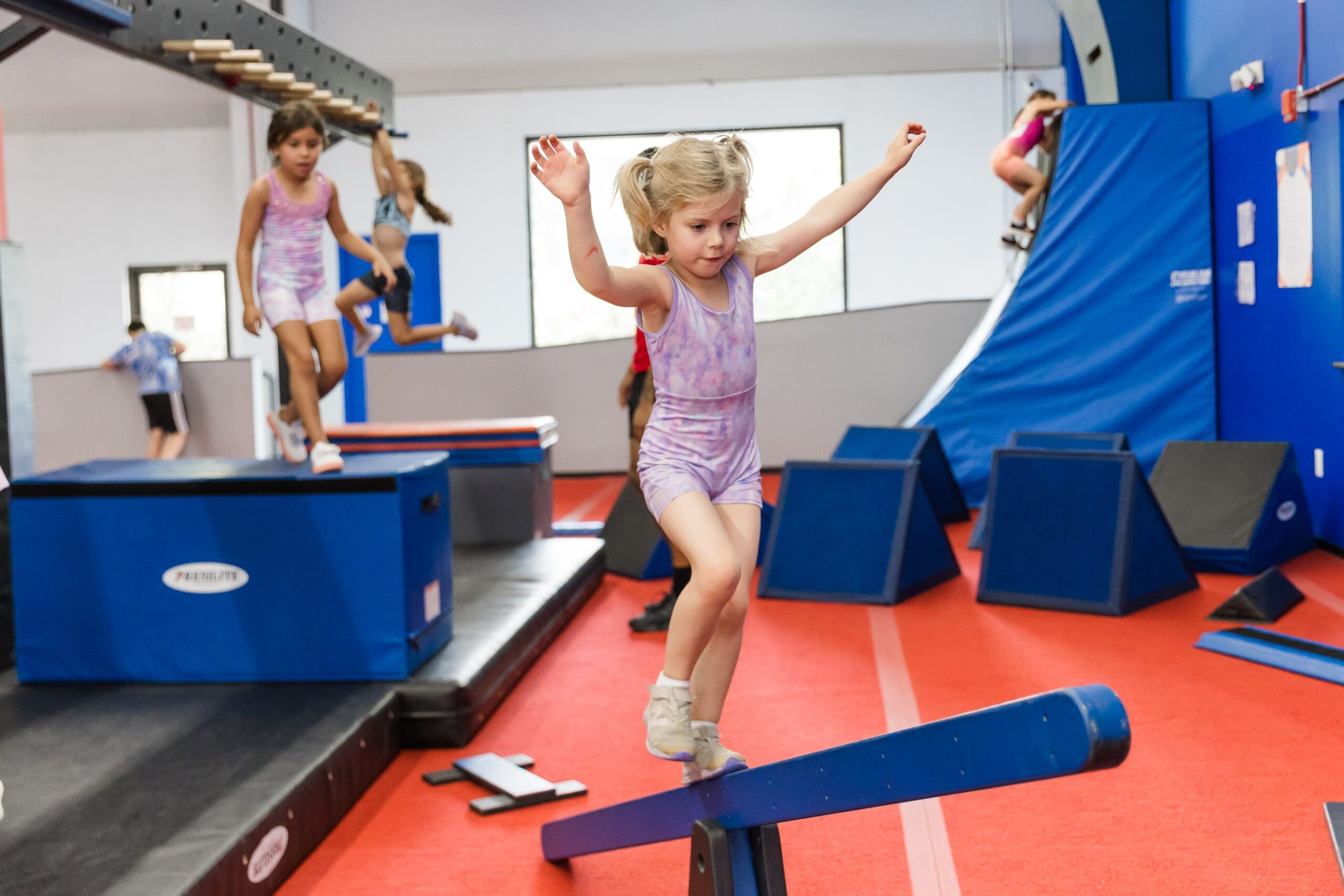 Read more about the article The Science Behind Gymnastics: Why Early Childhood Activities Matter for Alpharetta Kids