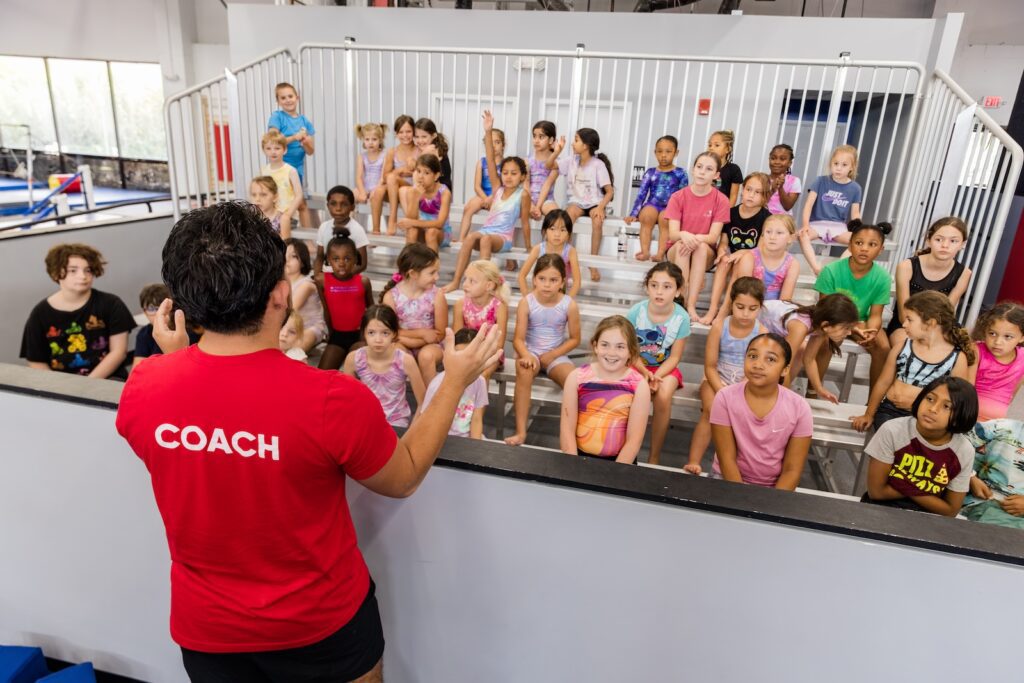 Working with kids at Dominique Dawes Academy