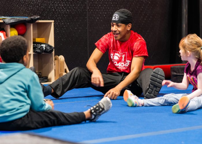 gymnastics teacher teaching students