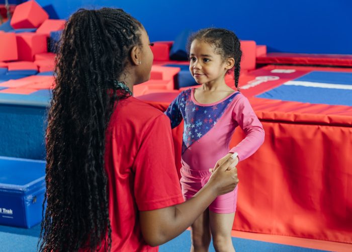 Working with kids at Dominique Dawes Academy