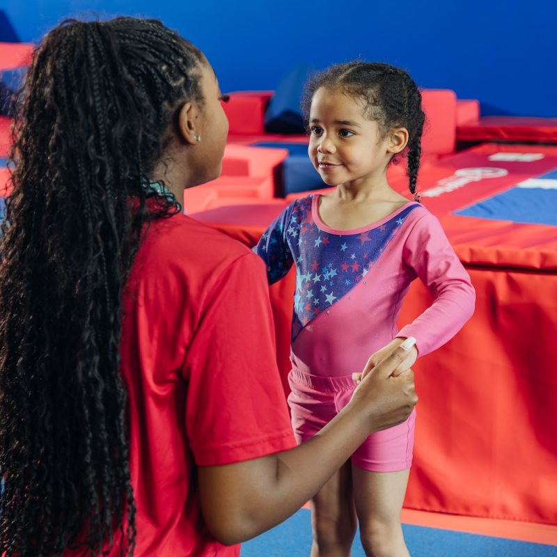 Working with kids at Dominique Dawes Academy