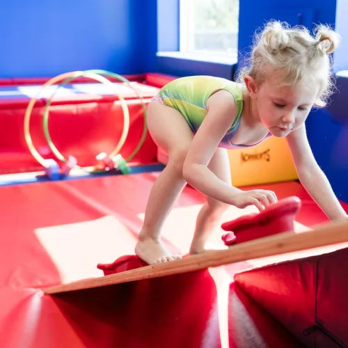 little girl trying to balance