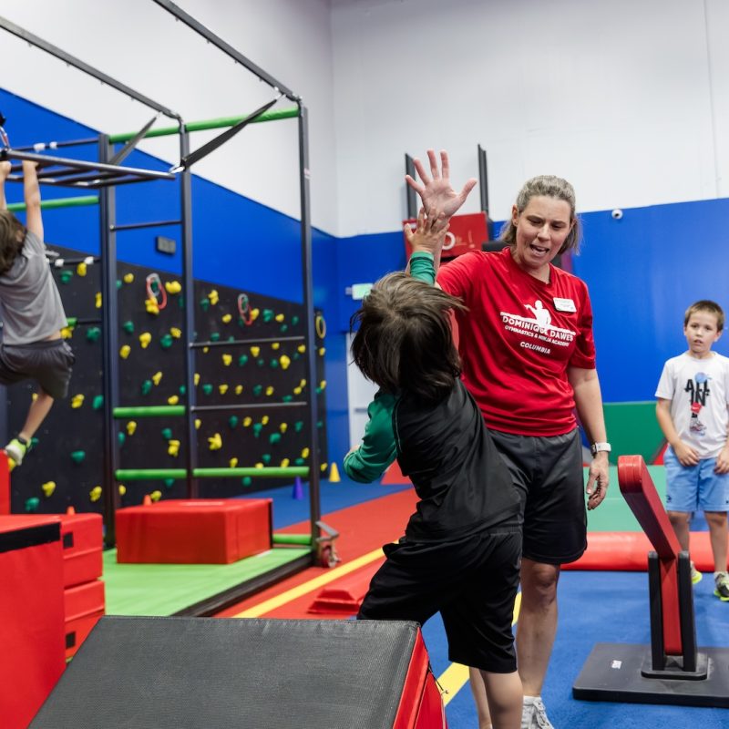 Working with kids at Dominique Dawes Academy