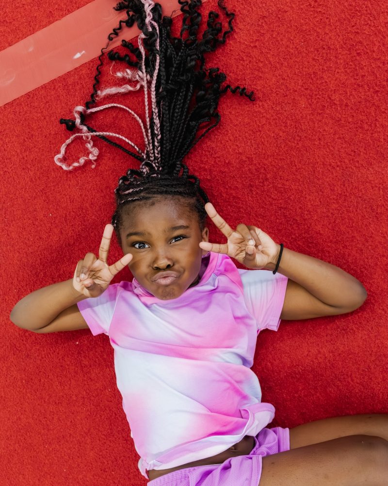 Little girl posing at gymnastics class at Dominique Dawes Academy