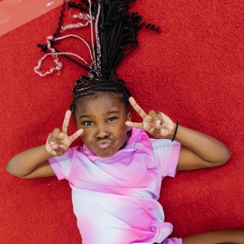 Little girl posing at gymnastics class at Dominique Dawes Academy