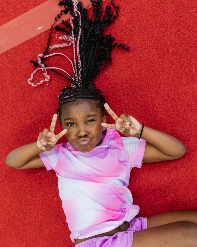 Little girl posing at gymnastics class at Dominique Dawes Academy