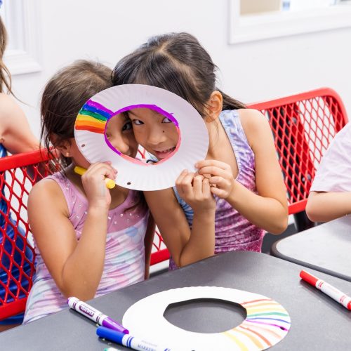 Two girls having fun in class at Dominique Dawes Academy